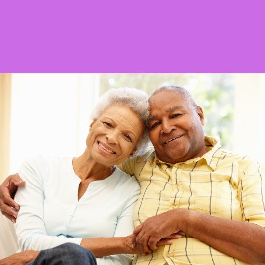 a man and woman sitting on a couch