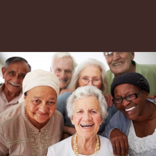 a group of older people smiling